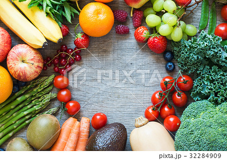 Different fruits and vegetables on wooden table Different fruits and vegetables on wooden table 32284909