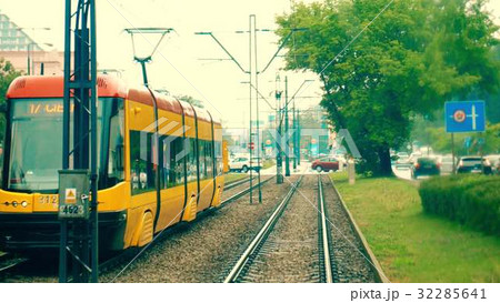 Moving modern city tram and road traffic 32285641