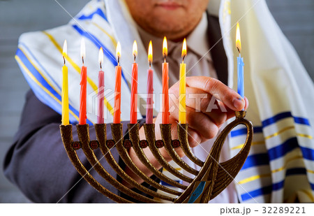 Jewish celebration. Candles burning in the menorah Jewish celebration. Candles burning in the menorah 32289221