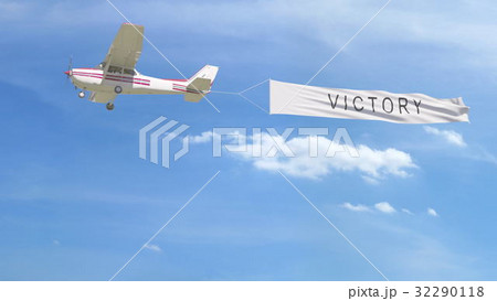 Small propeller airplane towing banner with Small propeller airplane towing banner with 32290118