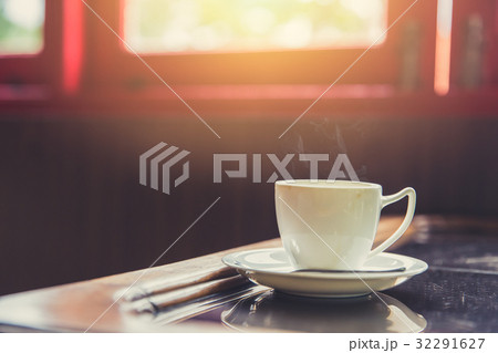 hot coffee with morning sun light from windows 32291627