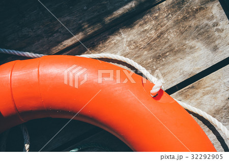 Life buoy hanging on wooden wall for emergency 32292905