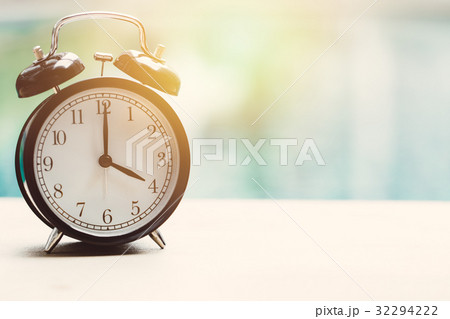 4 o'clock retro clock at the swimming pool 4 o'clock retro clock at the swimming pool 32294222