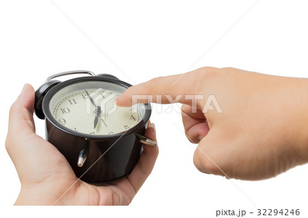 closeup hand point finger at the clock isolated 32294246