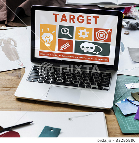 Laptop on the table with creative icons on screen 32295986