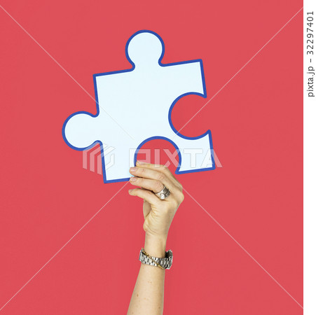 Human Hand Holding Puzzle Piece 32297401