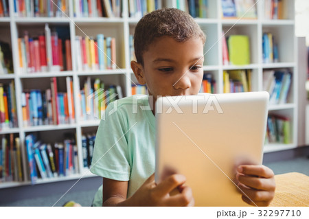 Little boy using a tablet Little boy using a tablet 32297710