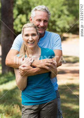 Couple smiling and holding each other Couple smiling and holding each other 32297747