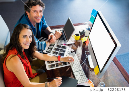 Colleagues using a graphic pad Colleagues using a graphic pad 32298173