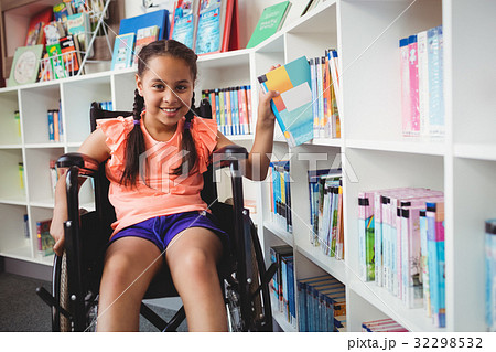 Girl sitting in a wheelchair 32298532