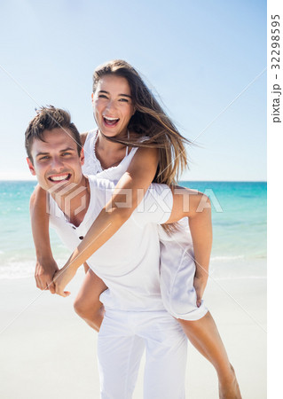 Portrait of handsome man holding his girlfriend 32298595