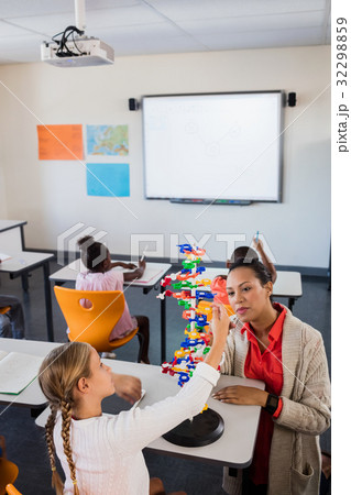 Teacher giving lesson to her students Teacher giving lesson to her students 32298859