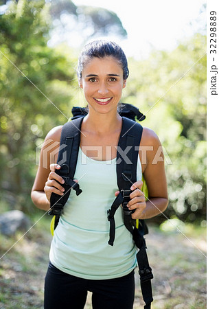 Woman smiling and posing with a backpack 32298889