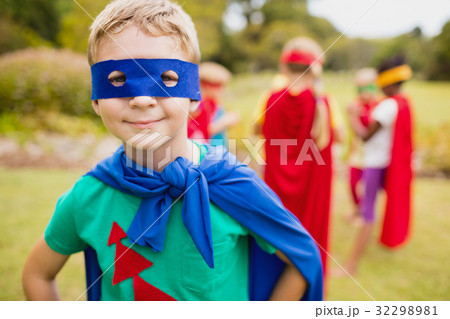 Portrait of young boy smiling and wearing a superhero dress Portrait of young boy smiling and wearing a superhero dress 32298981
