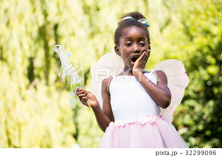 Cute mixed-race girl wearing a fairy dress Cute mixed-race girl wearing a fairy dress 32299096