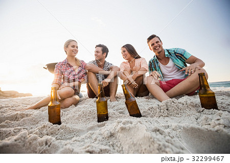 Smiling friends sitting 32299467