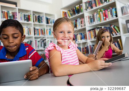 Portrait of smiling girl with tablet pc 32299687
