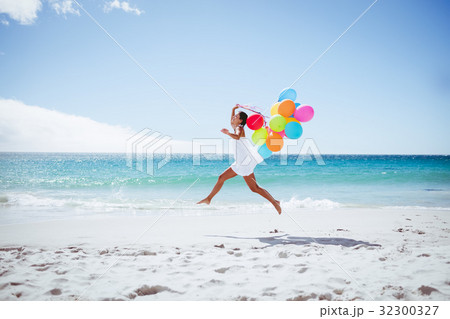 Beautiful woman holding balloon 32300327