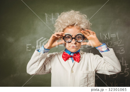 Boy standing in front of blackboard Boy standing in front of blackboard 32301065