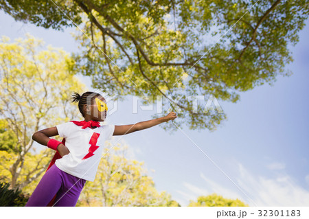 Cute girl pretending to be a superhero Cute girl pretending to be a superhero 32301183