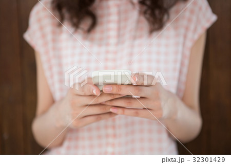 Hipster woman texting someone 32301429