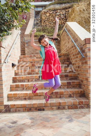 Cute little brunette child jumping Cute little brunette child jumping 32301456