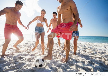 Friends playing football 32303202
