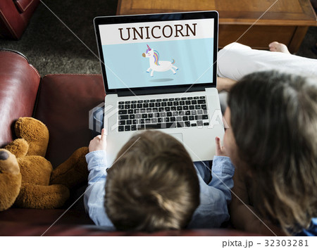 Parent working on laptop with child network graphic overlay Parent working on laptop with child network graphic overlay 32303281