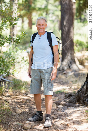 Hiker smiling and posing Hiker smiling and posing 32304116