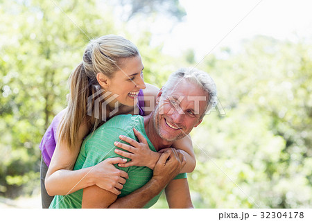 Couple smiling and holding each other Couple smiling and holding each other 32304178