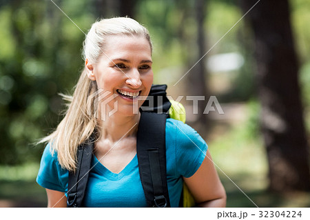 Portrait of a woman smiling with a backpack 32304224
