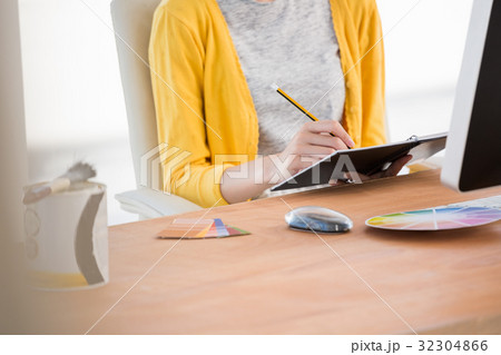 A woman is writing in a diary 32304866