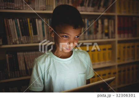 Little boy using a tablet Little boy using a tablet 32306301