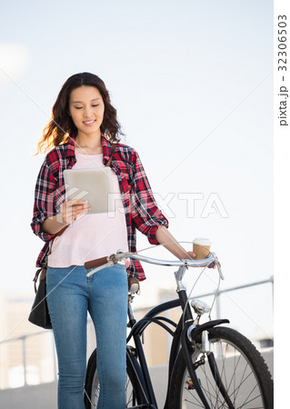 Hipster walking her bike Hipster walking her bike 32306503