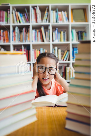 Girl sitting at a desk Girl sitting at a desk 32306572