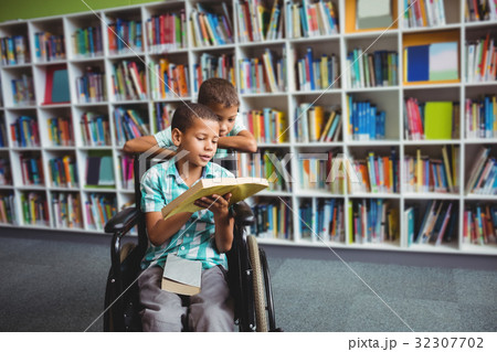 Little boys reading a book 32307702