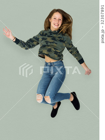 Young Adult Woman Jumping Studio Portrait 32307891