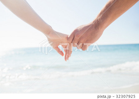 happy couple holding hands happy couple holding hands 32307925
