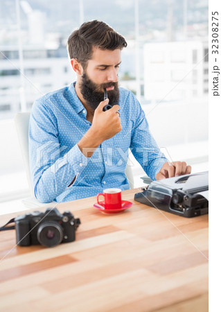 Hipster using type writer 32308275