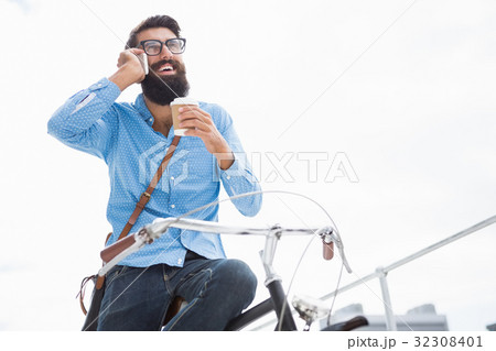 Hipster calling someone Hipster calling someone 32308401