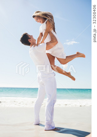 Portrait of handsome man holding his girlfriend 32308406