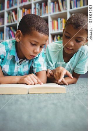 Little boys reading a book 32308503