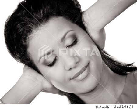 Mixed race woman closing ears with hands. 32314373