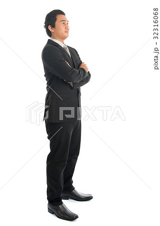Side view Asian businessman arms folded Side view Asian businessman arms folded 32316068