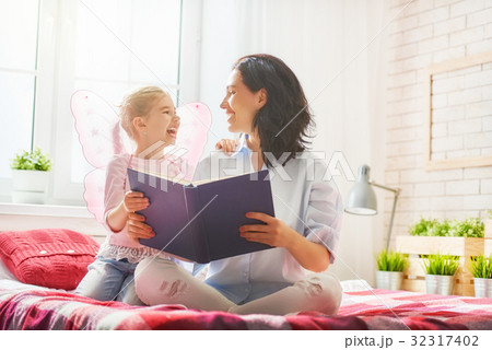 mother reading a book mother reading a book 32317402