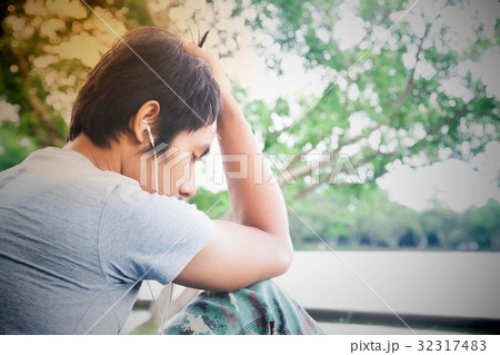 Asian broken heart man listening music Asian broken heart man listening music 32317483