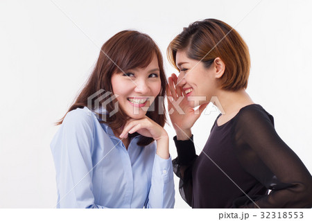 woman gossiping, whispering, listening to rumor 32318553