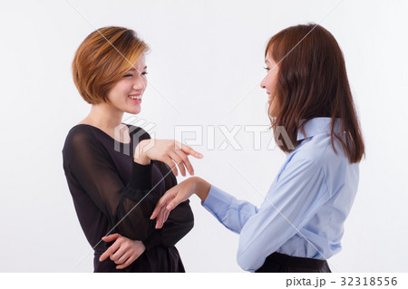 happy women talking, chatting, gossiping happy women talking, chatting, gossiping 32318556