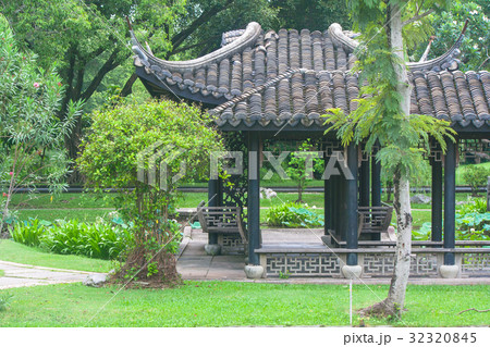 Chinese pagoda surrounded with green trees. Chinese pagoda surrounded with green trees. 32320845