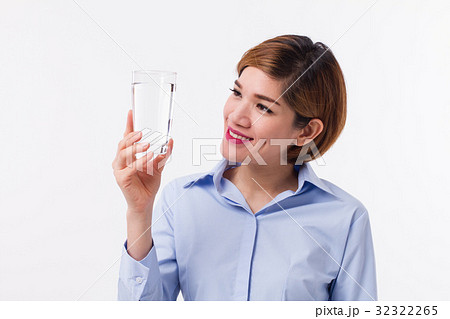 healthy asian woman holding glass of fresh water 32322265
